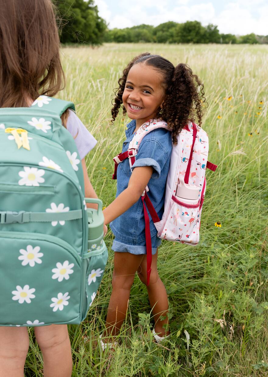 Children carrying colorful backpacks